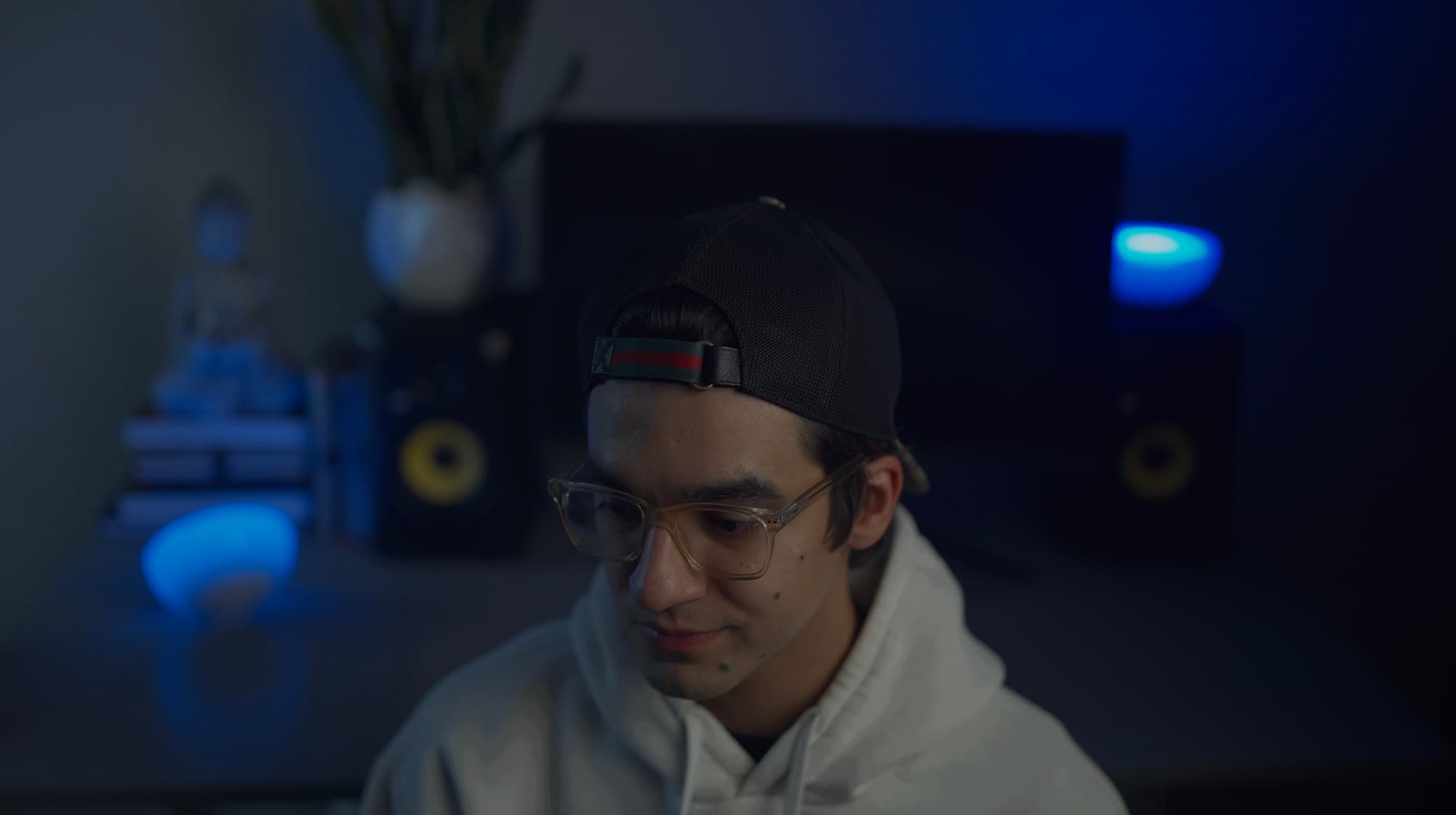 Low-light portrait study with blue practical lighting.