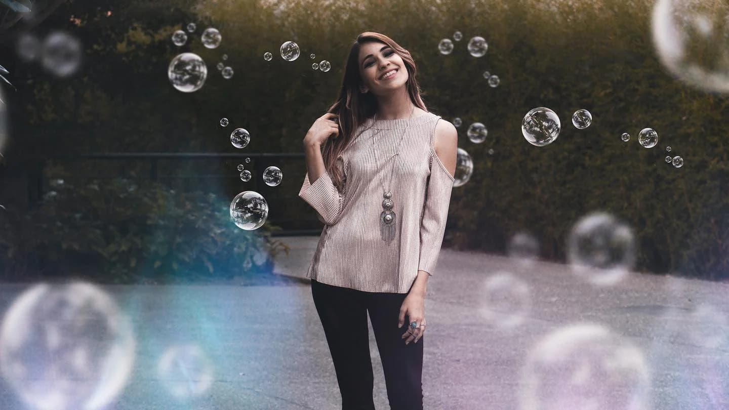 Portrait surrounded by floating bubbles