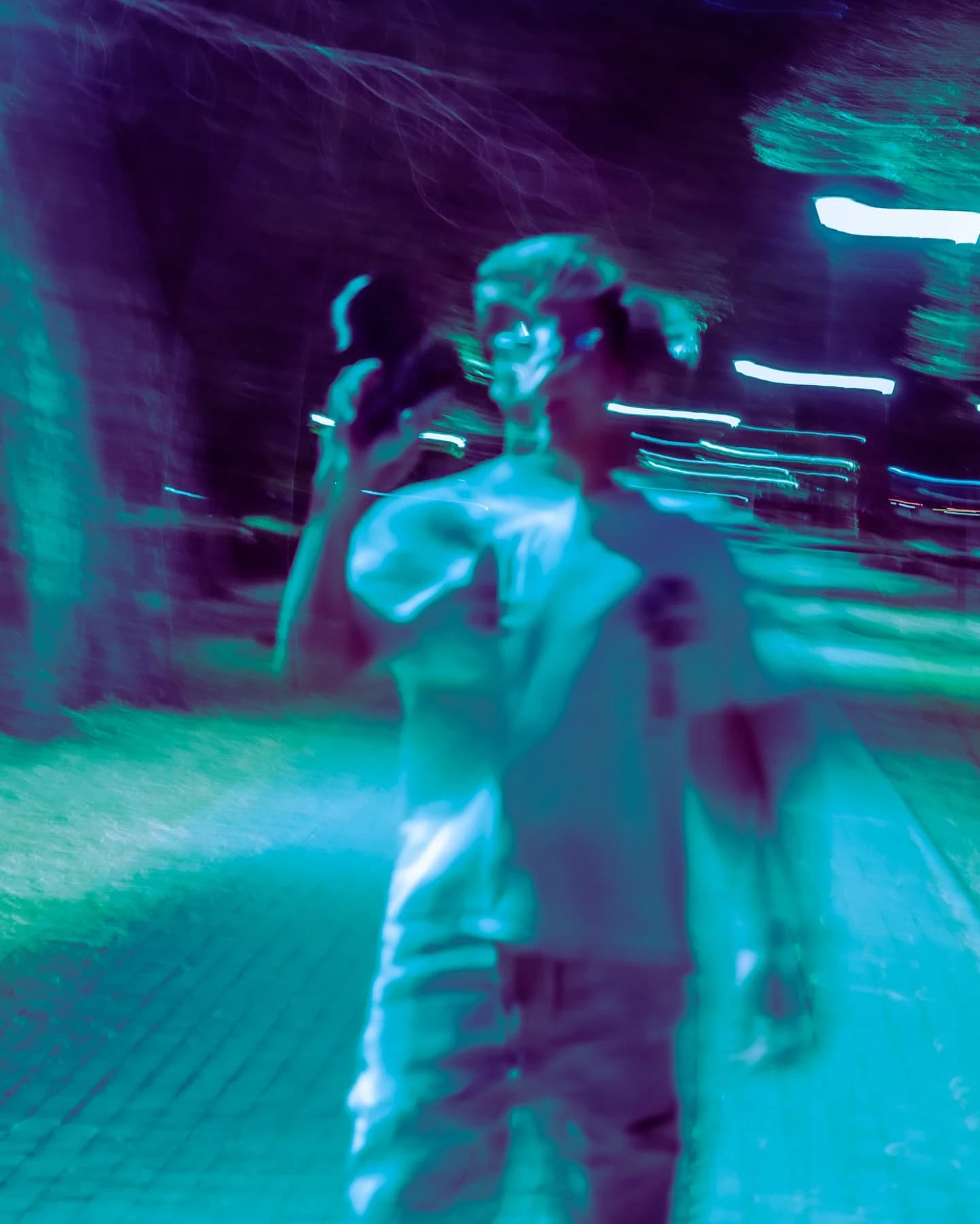 Cyan motion portrait of two figures