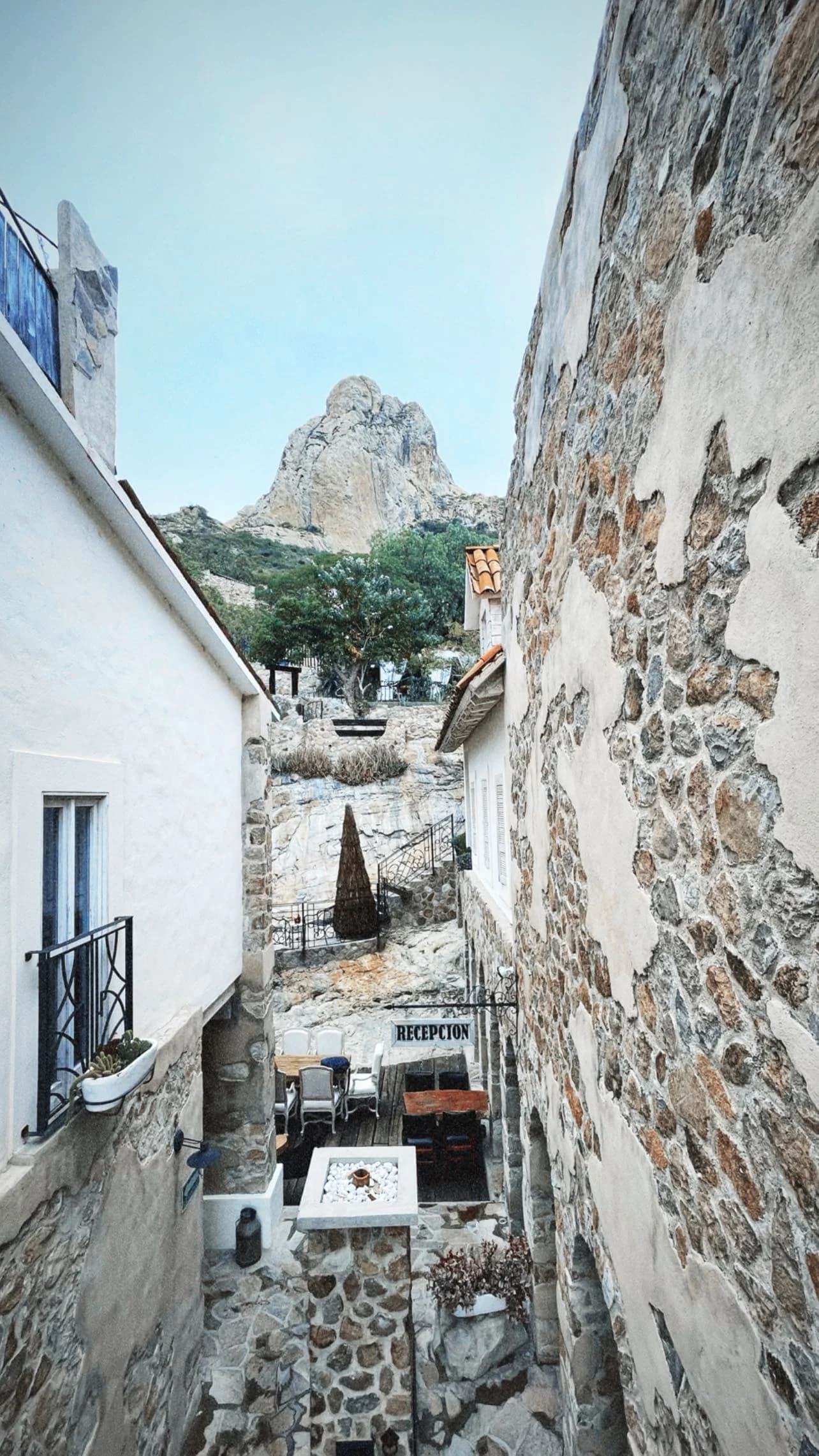 Stone courtyard opening toward a mountain