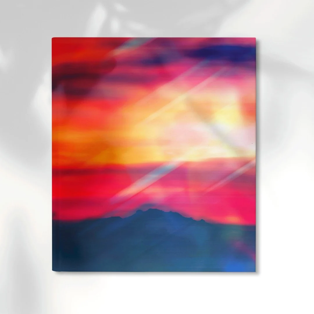 A vivid red, pink and blue photographic artwork presented as a wall print