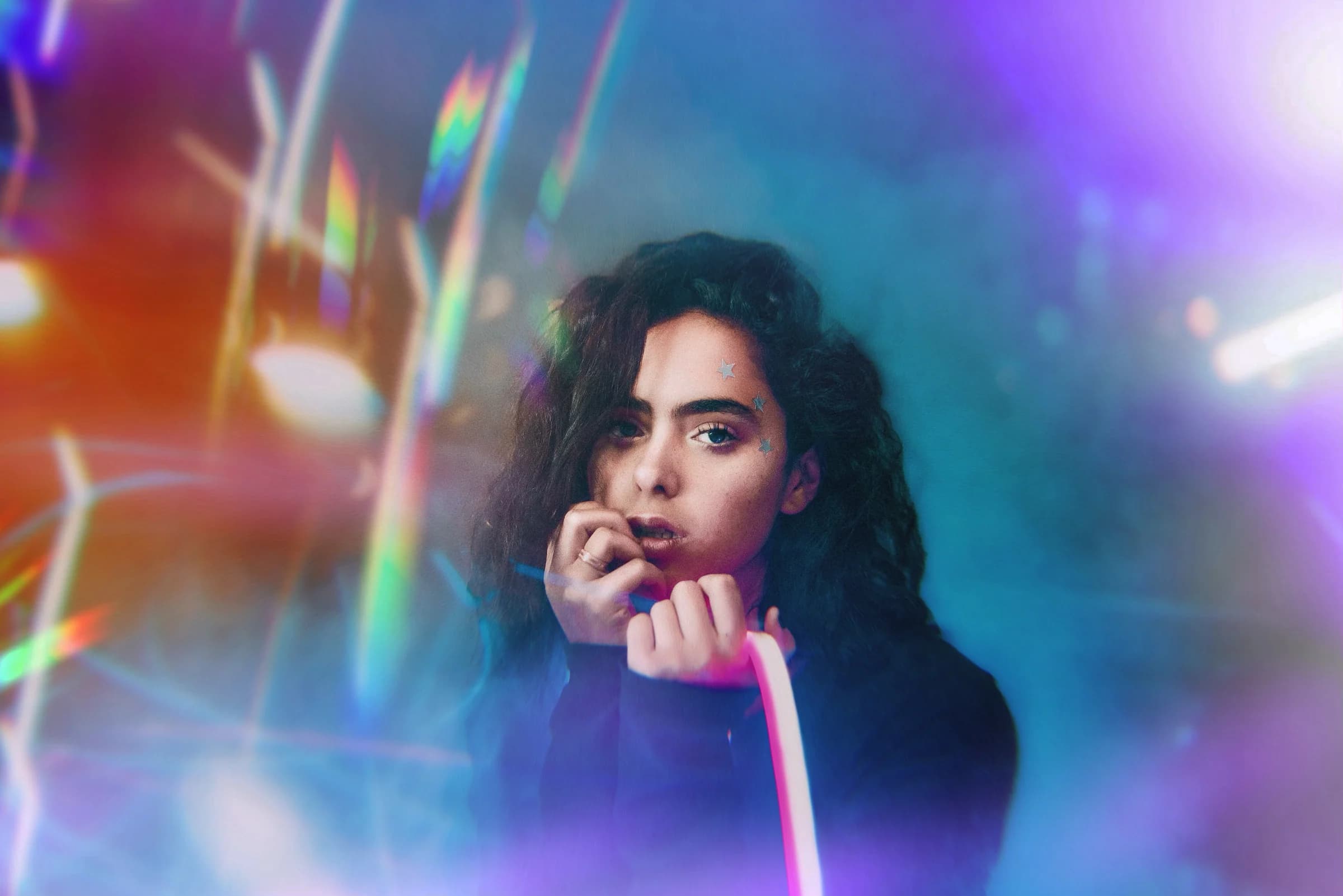 Portrait of a woman framed through prismatic light