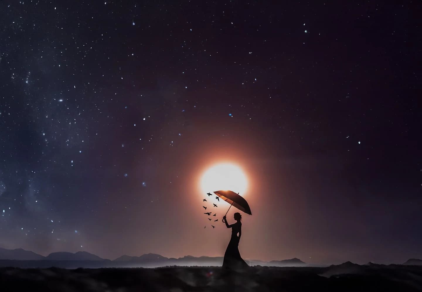 Silhouette holding an umbrella beneath a glowing celestial body and stars