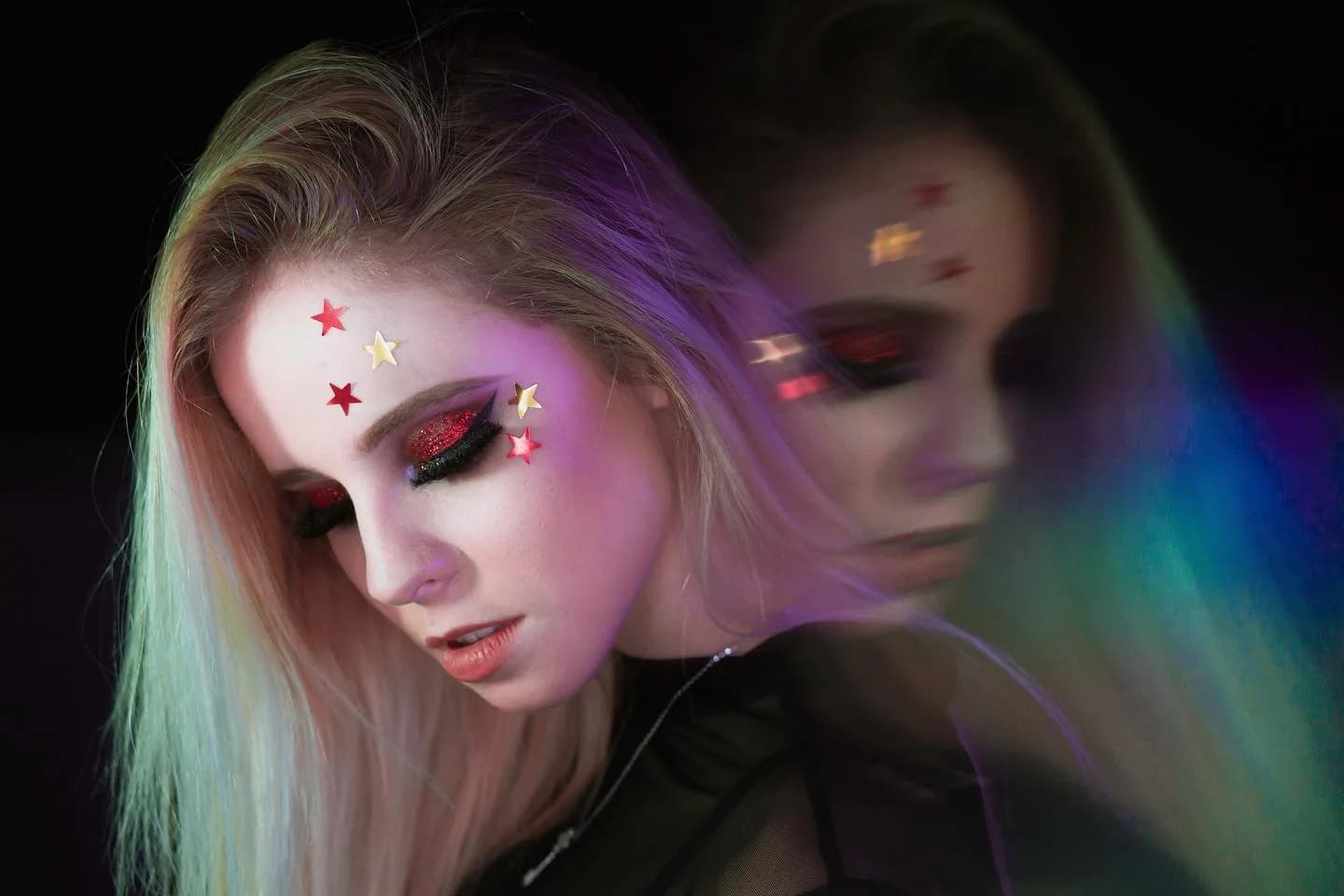 Portrait with star makeup and a doubled figure
